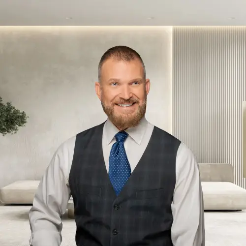 Professional portrait of a mortgage broker from Team Shrum | KMC Financial in a modern office setting